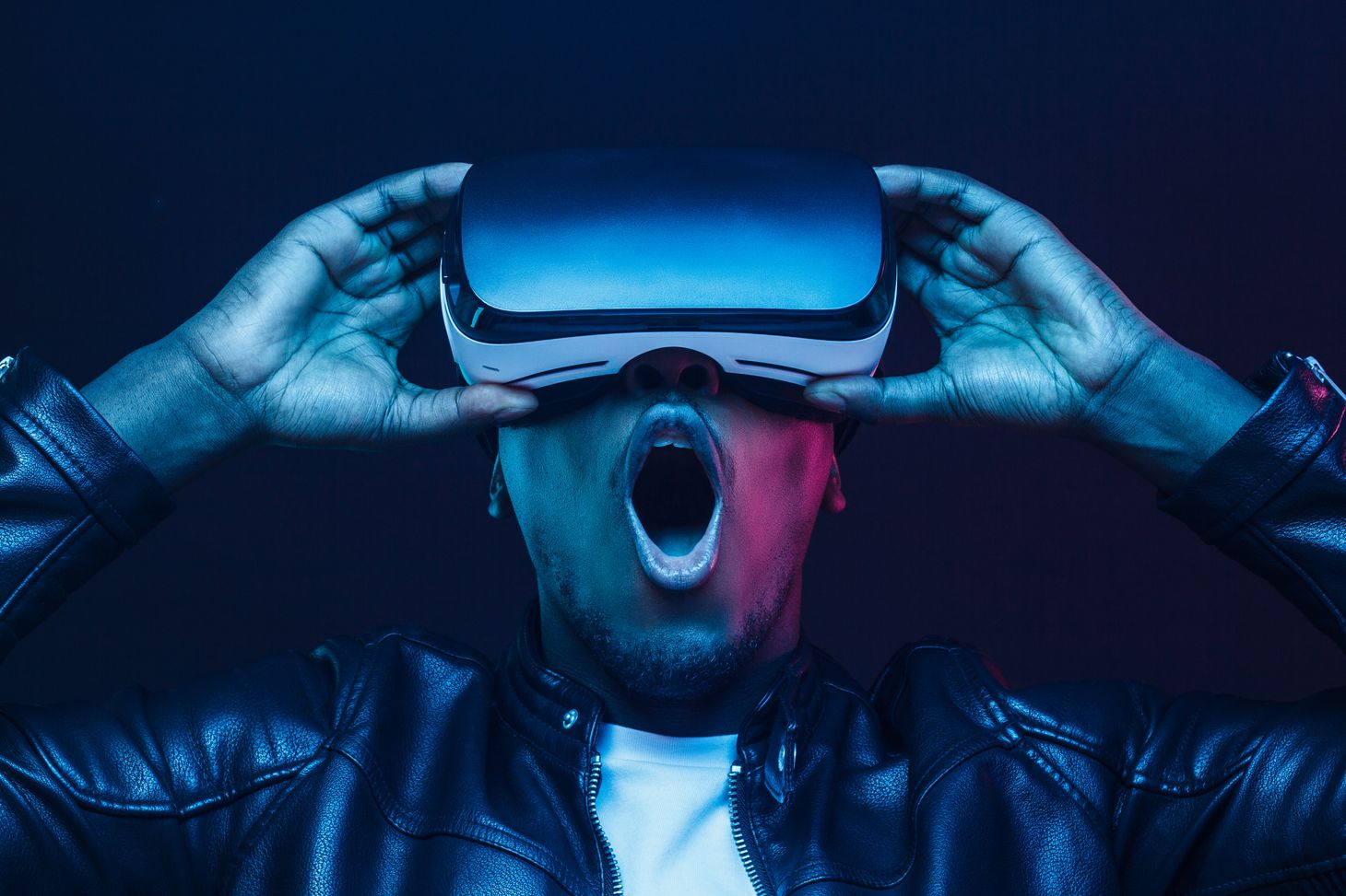 Image of a person with VR goggles who is being shocked by what he sees